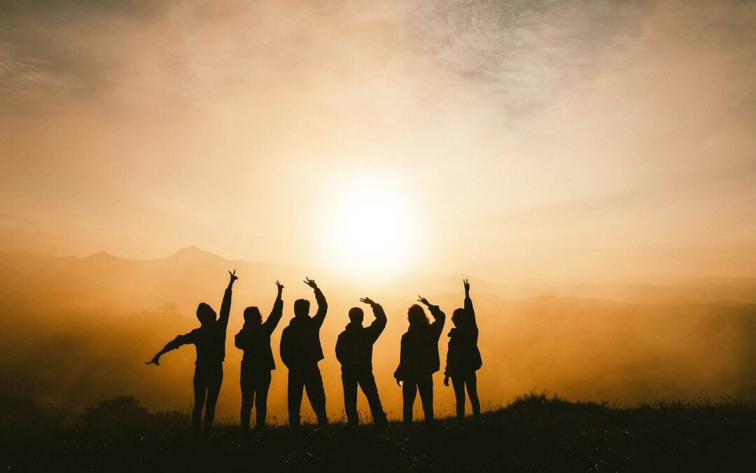 silhouette photo of six persons on top of mountain