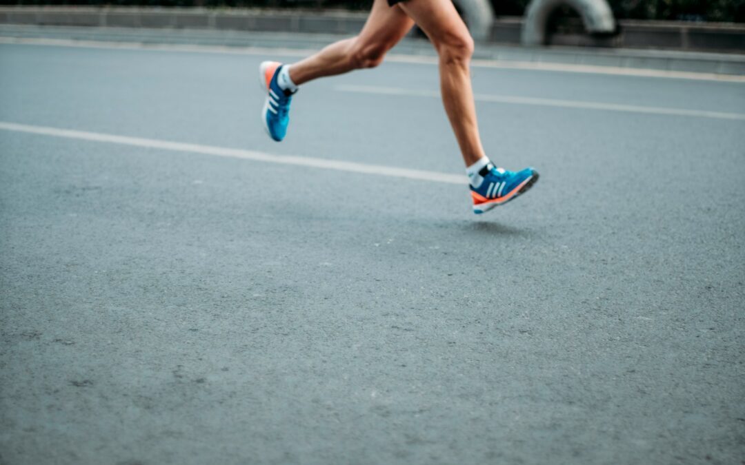pair of blue-and-white Adidas running shoes