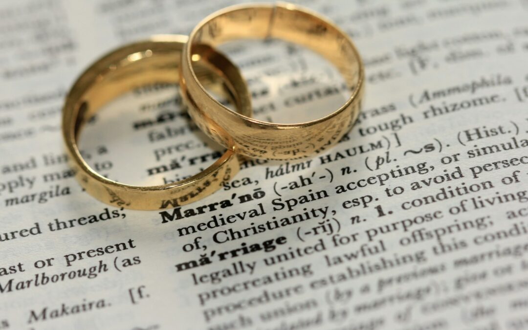 two gold-colored rings on paper