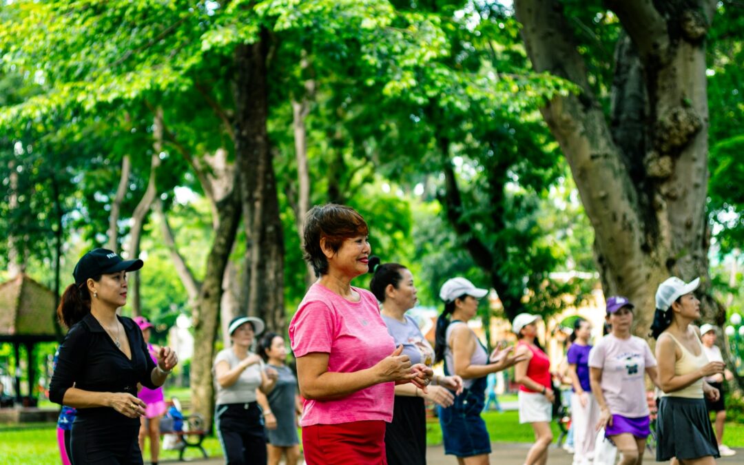 Group of women exercising in a park.
